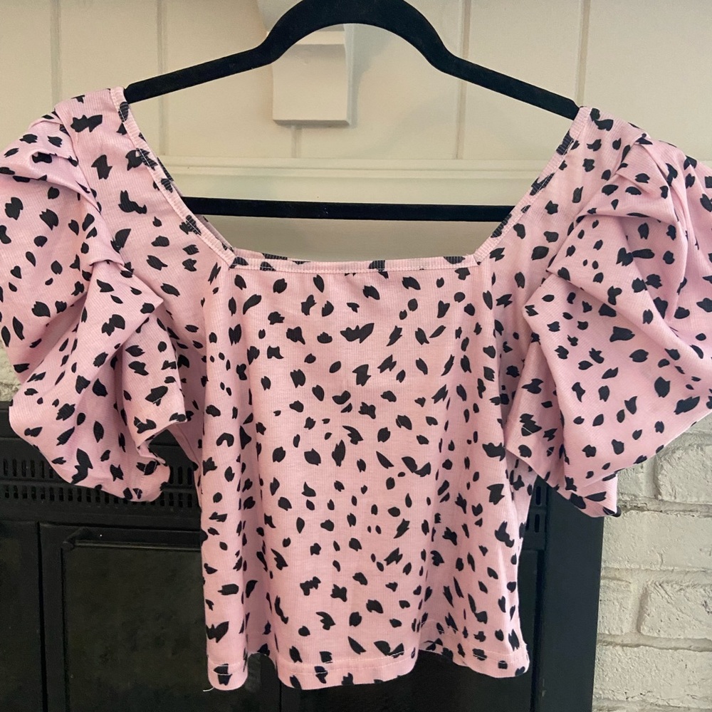 Pink and black puffed sleeve top.